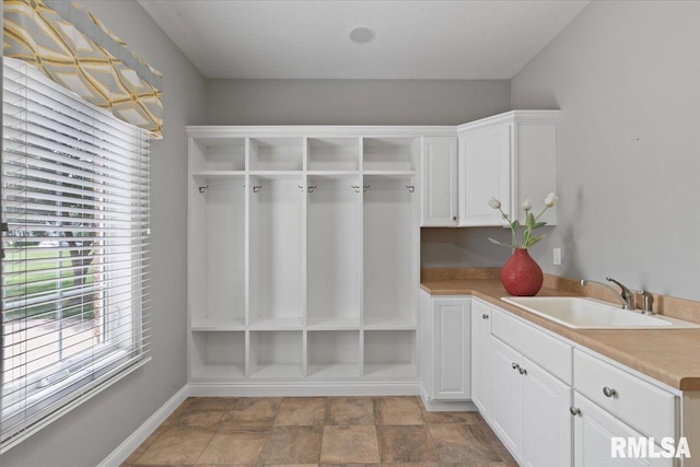 5985 Eagle Ridge Rd, Bettendorf, IA 52722 - mudroom with a sink and stone finish flooring
