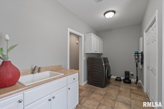 5985 Eagle Ridge Rd, Bettendorf, IA 52722 - laundry area with cabinet space and a textured ceiling