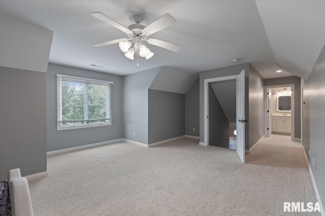 5985 Eagle Ridge Rd, Bettendorf, IA 52722 - additional living space featuring light colored carpet and a ceiling fan