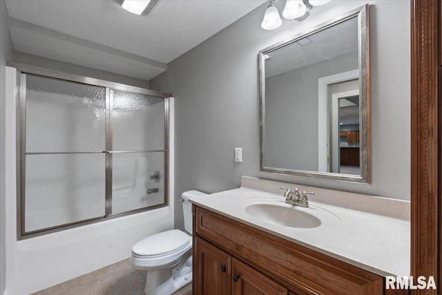 5985 Eagle Ridge Rd, Bettendorf, IA 52722 - full bath featuring vanity, shower / bath combination with glass door, and tile patterned floors