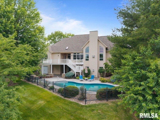 5985 Eagle Ridge Rd, Bettendorf, IA 52722 - rear view of property with stairway, a chimney, a deck, and a patio