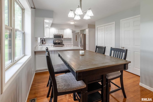 1514 E Willow Dr, Marion, IL 62959 - dining area featuring light wood-type flooring and a chandelier