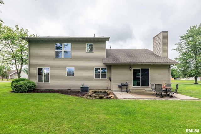1514 E Willow Dr, Marion, IL 62959 - back of house with a yard, a patio area, and a chimney