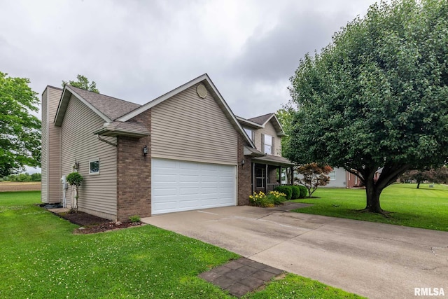 1514 E Willow Dr, Marion, IL 62959 - view of side of property featuring brick siding, driveway, a lawn, and a chimney