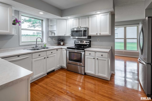 1514 E Willow Dr, Marion, IL 62959 - kitchen with appliances with stainless steel finishes, light wood-style floors, white cabinets, and recessed lighting
