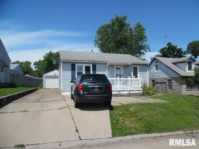 1444 Prospect Ave, Clinton, IA 52732 - view of front of property with an outdoor structure, a wooden deck, a detached garage, and a front yard