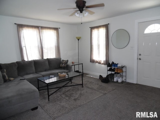 1444 Prospect Ave, Clinton, IA 52732 - carpeted living area with a ceiling fan and plenty of natural light
