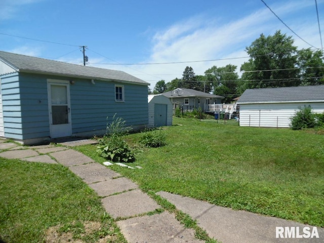 1444 Prospect Ave, Clinton, IA 52732 - view of green lawn featuring a shed