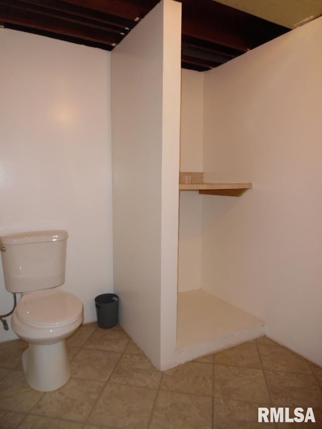 1444 Prospect Ave, Clinton, IA 52732 - bathroom featuring tile patterned flooring and a shower