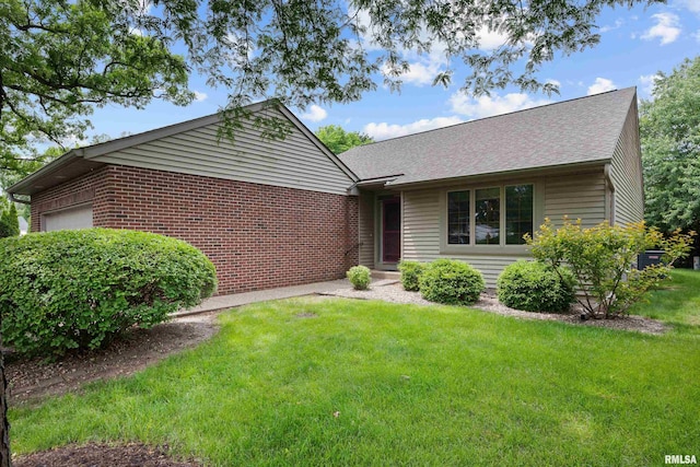 10 Briarwood Ln Unit 10, Rock Island, IL 61201 - ranch-style home with a garage, a front lawn, a shingled roof, and brick siding