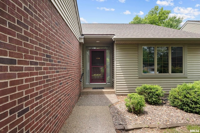 10 Briarwood Ln Unit 10, Rock Island, IL 61201 - view of exterior entry with a shingled roof
