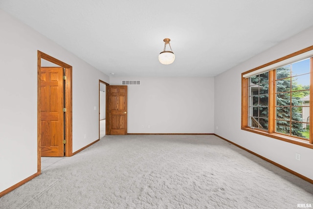 10 Briarwood Ln Unit 10, Rock Island, IL 61201 - empty room with carpet flooring and baseboards