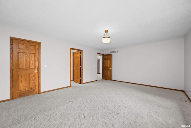 10 Briarwood Ln Unit 10, Rock Island, IL 61201 - unfurnished bedroom featuring light colored carpet