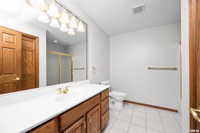 10 Briarwood Ln Unit 10, Rock Island, IL 61201 - bathroom with vanity, a shower stall, tile patterned flooring, and a textured ceiling