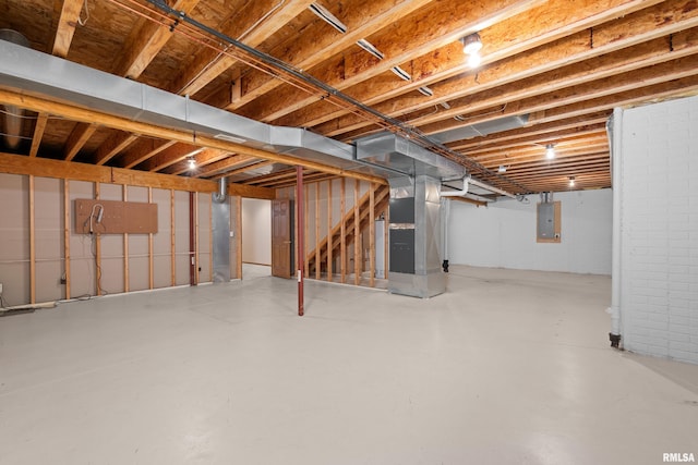 10 Briarwood Ln Unit 10, Rock Island, IL 61201 - unfinished basement featuring heating unit, electric panel, stairs, and gas water heater