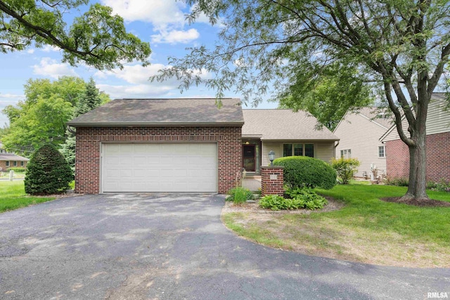 10 Briarwood Ln Unit 10, Rock Island, IL 61201 - view of front of property with asphalt driveway, a garage, brick siding, and roof with shingles