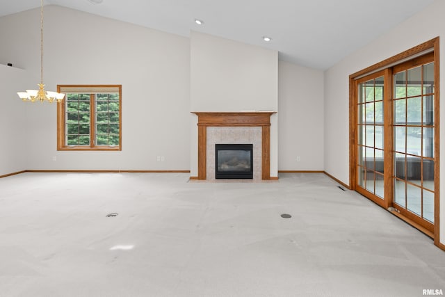 10 Briarwood Ln Unit 10, Rock Island, IL 61201 - unfurnished living room featuring carpet flooring, vaulted ceiling, a chandelier, a fireplace, and recessed lighting
