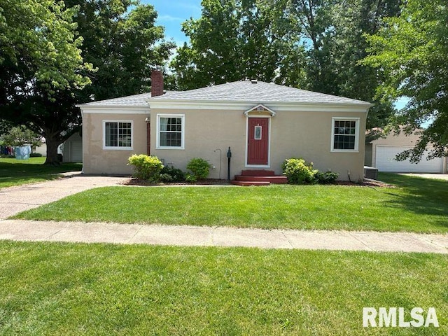 611 13th St, De Witt, IA 52742 - ranch-style home with a chimney, a front yard, stucco siding, and entry steps