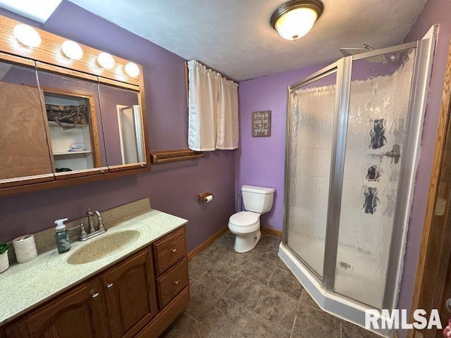 611 13th St, De Witt, IA 52742 - bathroom featuring a shower stall, vanity, and tile patterned floors