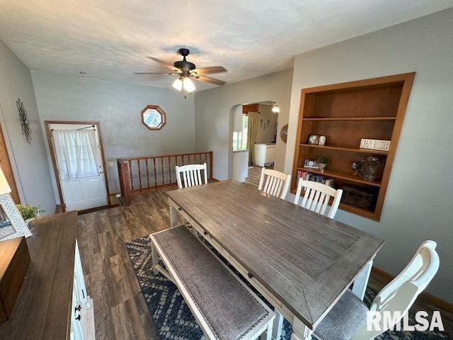 611 13th St, De Witt, IA 52742 - dining space with wood finished floors, arched walkways, and a ceiling fan