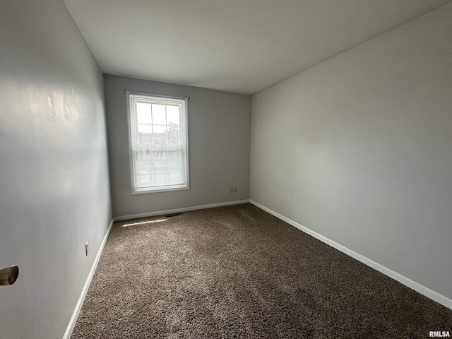 70 Carriage Hl, Macomb, IL 61455 - unfurnished room featuring carpet and baseboards