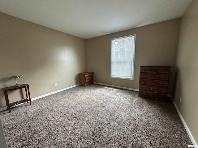 70 Carriage Hl, Macomb, IL 61455 - unfurnished bedroom featuring carpet