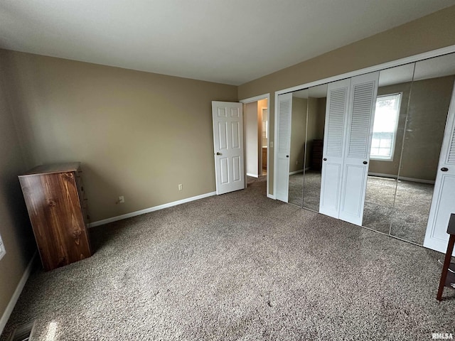 70 Carriage Hl, Macomb, IL 61455 - unfurnished bedroom featuring carpet and a closet