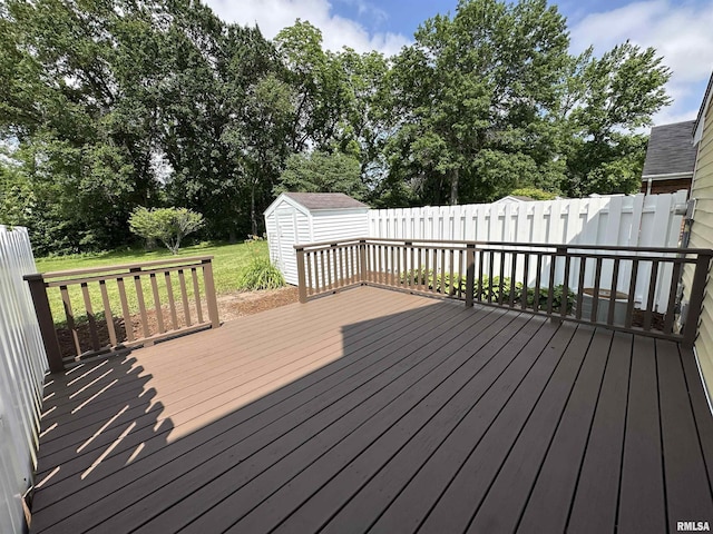 70 Carriage Hl, Macomb, IL 61455 - deck with a storage unit and view of wooded area