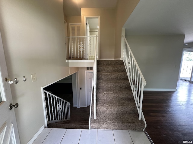 70 Carriage Hl, Macomb, IL 61455 - staircase featuring baseboards and tile patterned floors