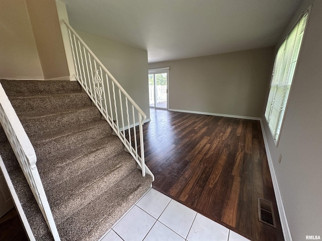 70 Carriage Hl, Macomb, IL 61455 - staircase featuring wood finished floors and baseboards