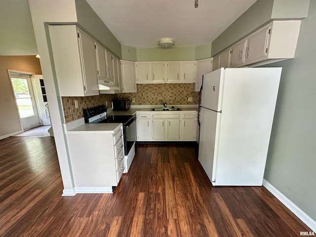 70 Carriage Hl, Macomb, IL 61455 - kitchen with freestanding refrigerator, black electric range, under cabinet range hood, and dark wood-style flooring