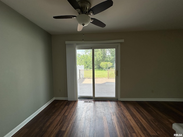 70 Carriage Hl, Macomb, IL 61455 - empty room with dark wood-style floors and a ceiling fan
