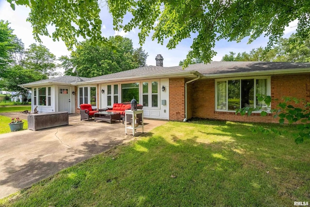 1278 Nicklaus Ln, Marion, IL 62959 - view of front of house featuring an outdoor hangout area, a patio, brick siding, a chimney, and a front lawn