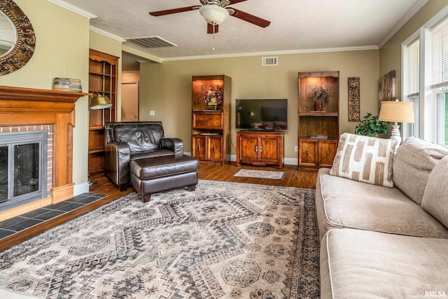1278 Nicklaus Ln, Marion, IL 62959 - living room with wood finished floors, a ceiling fan, a fireplace, and ornamental molding