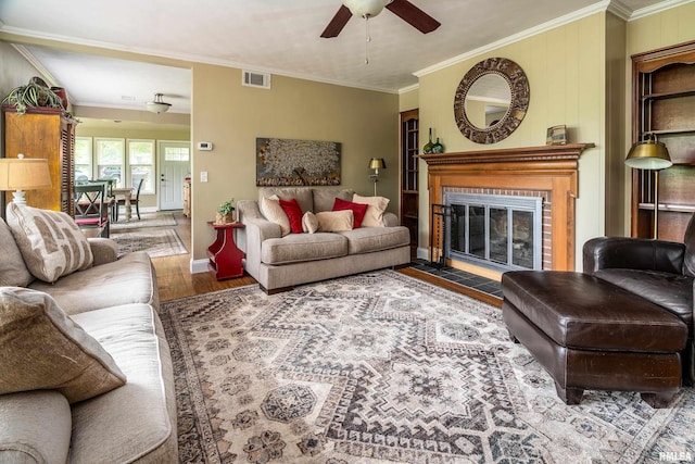 1278 Nicklaus Ln, Marion, IL 62959 - living room with a ceiling fan, wood finished floors, crown molding, and a fireplace with flush hearth