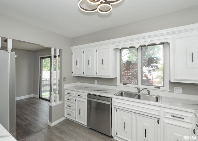 3503 36th St, Moline, IL 61265 - kitchen with appliances with stainless steel finishes, white cabinetry, light wood-type flooring, and a chandelier