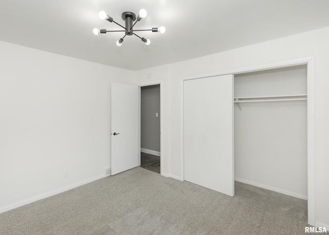 3503 36th St, Moline, IL 61265 - unfurnished bedroom featuring a chandelier, carpet floors, and a closet