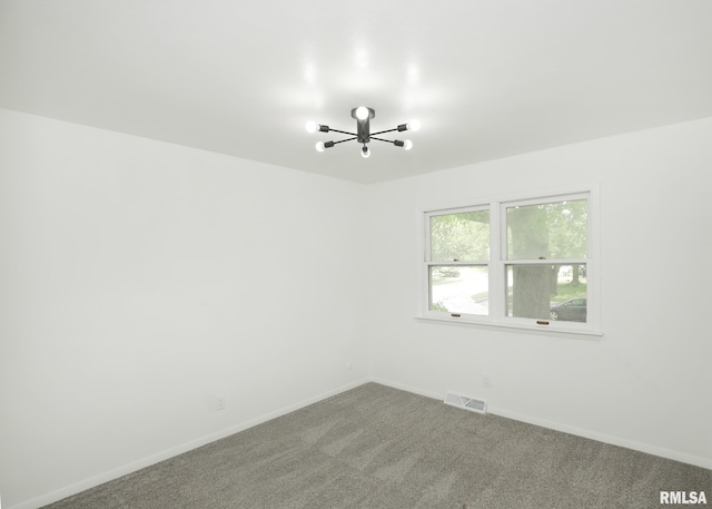 3503 36th St, Moline, IL 61265 - carpeted spare room with a chandelier and baseboards