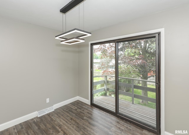 3503 36th St, Moline, IL 61265 - unfurnished room featuring plenty of natural light, dark wood finished floors, and a chandelier