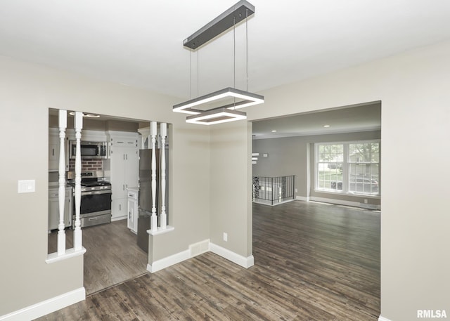 3503 36th St, Moline, IL 61265 - spare room featuring dark wood finished floors and baseboards