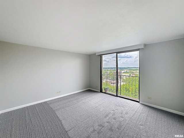 1800 7th St Unit 6D, East Moline, IL 61244 - carpeted spare room with baseboards