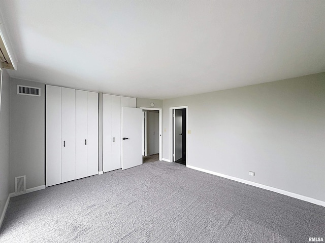 1800 7th St Unit 6D, East Moline, IL 61244 - unfurnished bedroom with two closets and carpet