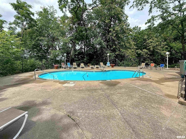 1800 7th St Unit 6D, East Moline, IL 61244 - community pool featuring a patio and view of scattered trees