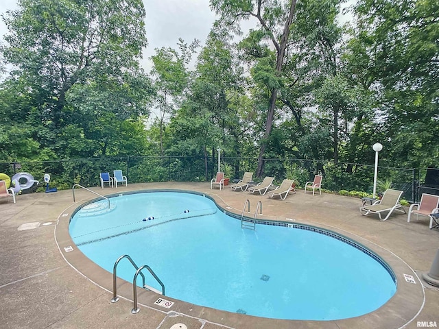 1800 7th St Unit 6D, East Moline, IL 61244 - community pool with a patio area and view of scattered trees