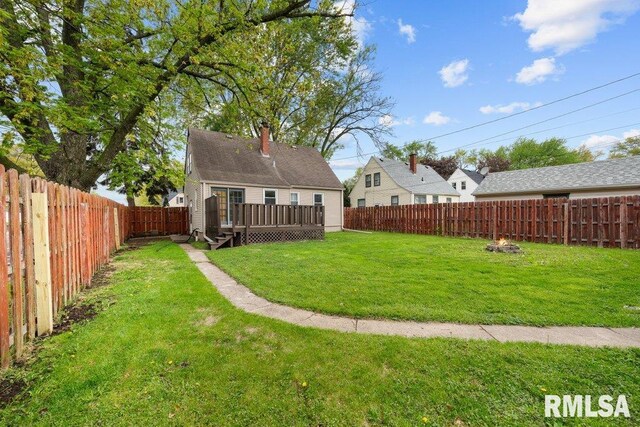 2605 Pacific St, Davenport, IA 52804 - fenced backyard with a deck