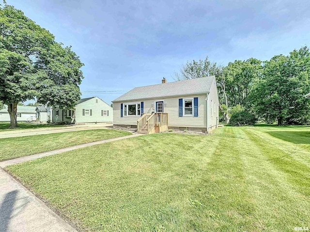 409 E Pearl St, Geneseo, IL 61254 - view of front of home with a chimney and a front lawn