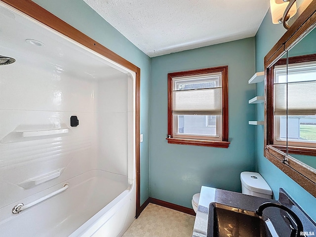 409 E Pearl St, Geneseo, IL 61254 - bathroom with healthy amount of natural light, vanity, a textured ceiling, and washtub / shower combination