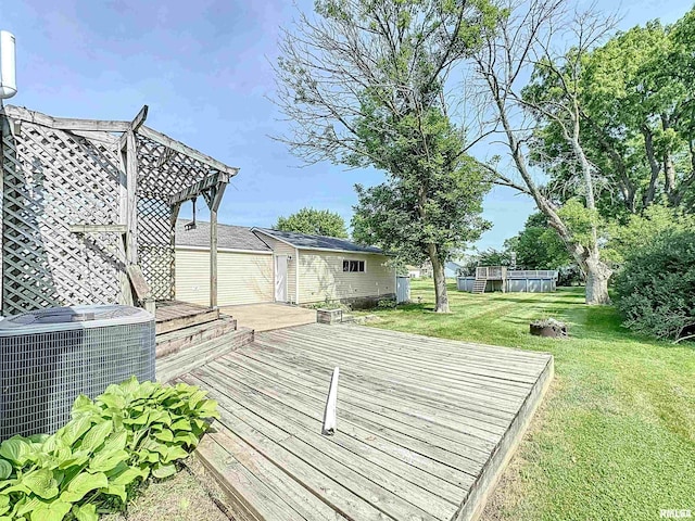 409 E Pearl St, Geneseo, IL 61254 - deck with a lawn and an outbuilding