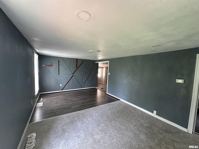 1415 45th Ave, Rock Island, IL 61201 - spare room featuring carpet flooring and wood finished floors