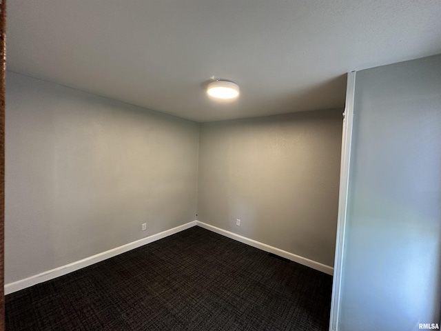 1415 45th Ave, Rock Island, IL 61201 - unfurnished room featuring dark carpet and baseboards